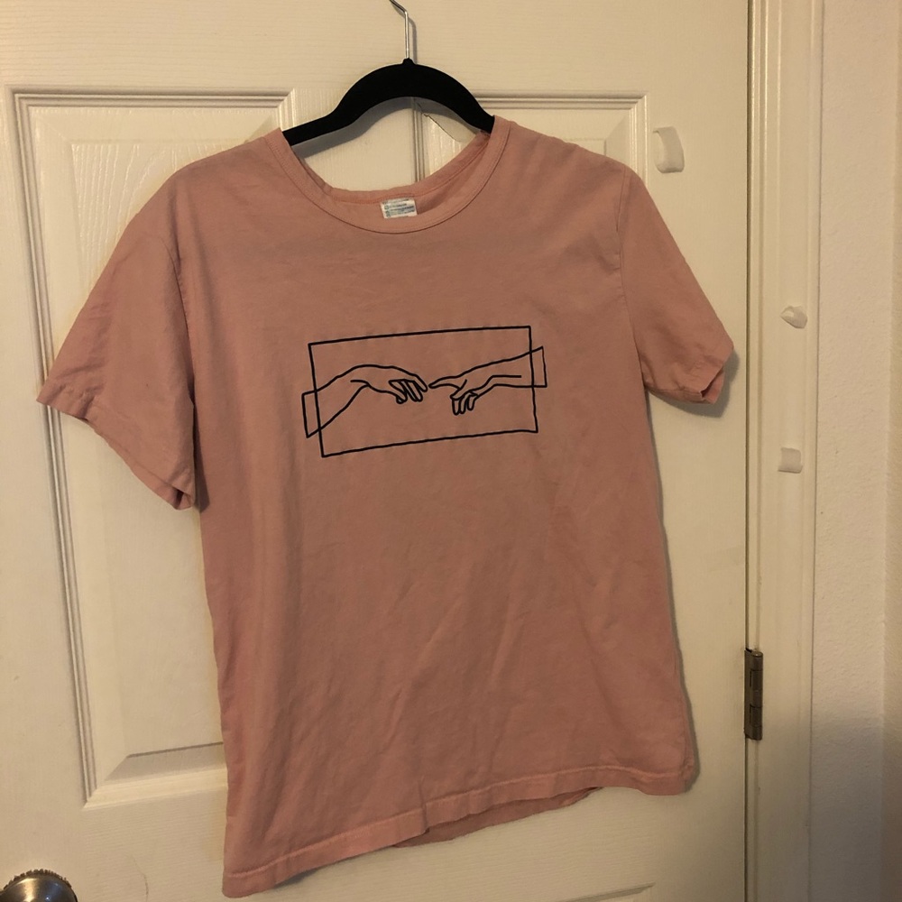 pink art shirt.